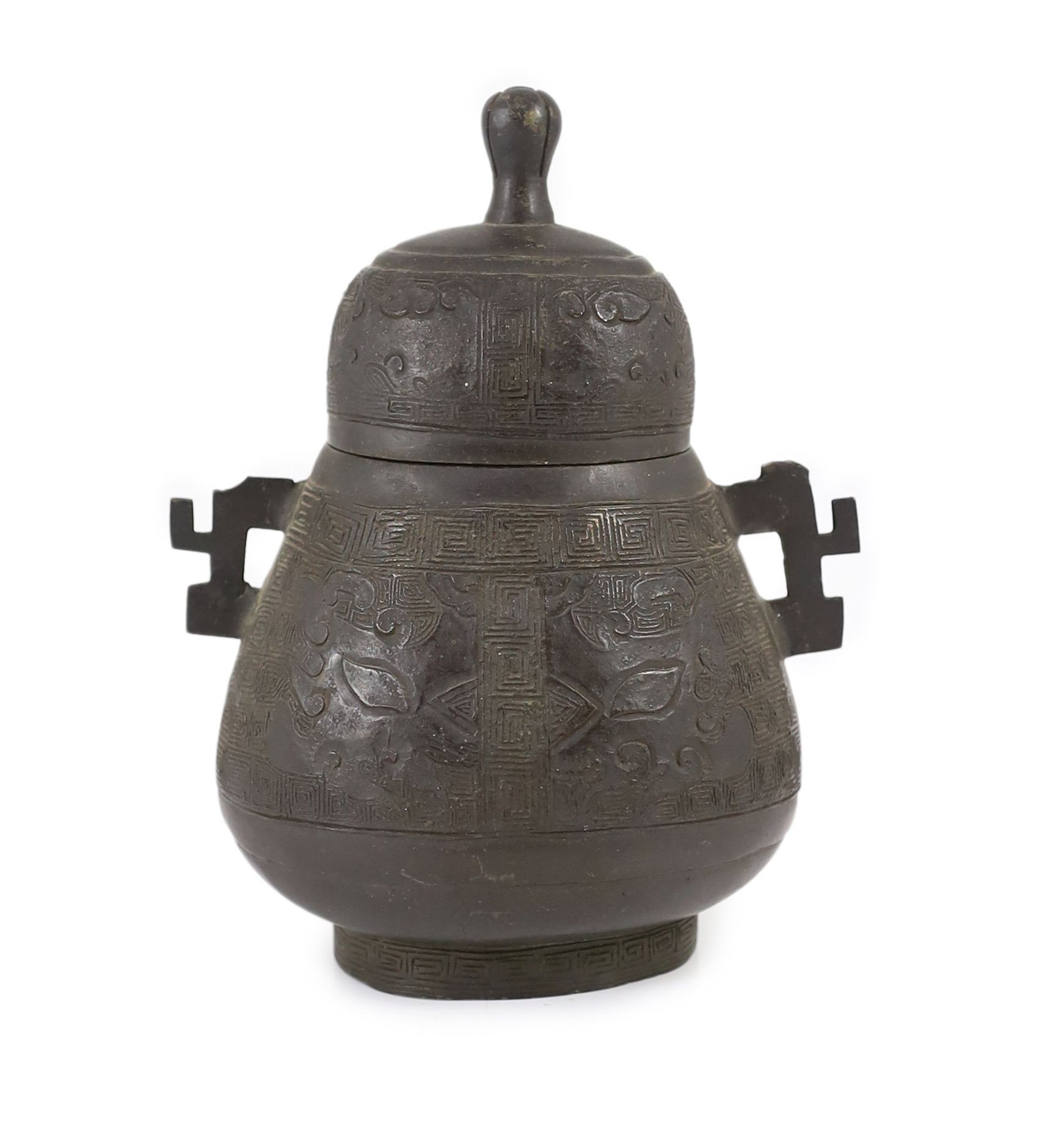 A Chinese bronze jar and cover, hu, 17th/18th century, 18cm high, losses to handles